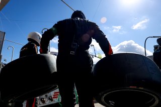 Mechanics in the pit lane