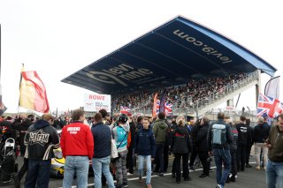 Fans watch the grid
